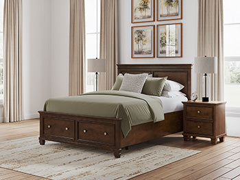 Ashley Furniture Danabrin panel storage bed with a modern design, featuring a sturdy wooden frame and built-in storage drawers.
