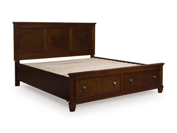 Ashley Furniture Danabrin panel storage bed with closed side panels and dark wood finish, shown from an angled view.