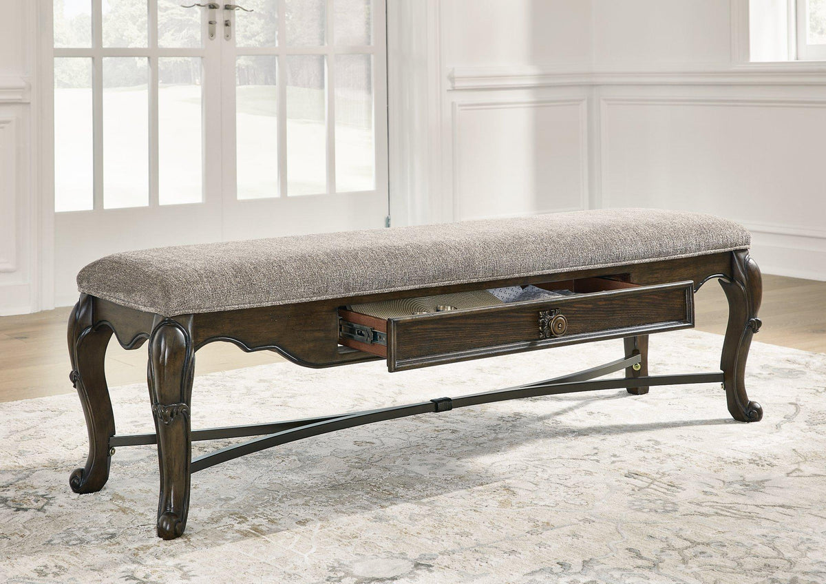 Ashley Maylee 63-inch wooden dining bench with cushioned seat and elegant design, perfect for kitchen or dining room seating.