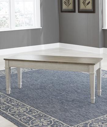 Ashley Furniture Skempton Storage Bench with cushioned top and wooden legs, ideal for entryways and living rooms.