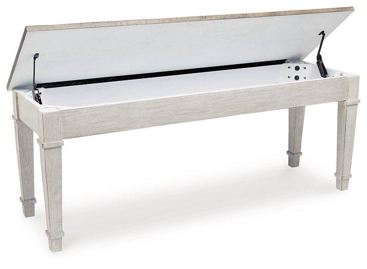 Ashley Furniture Skempton Storage Bench with wooden top and fabric upholstered seating, ideal for entryway or living room.