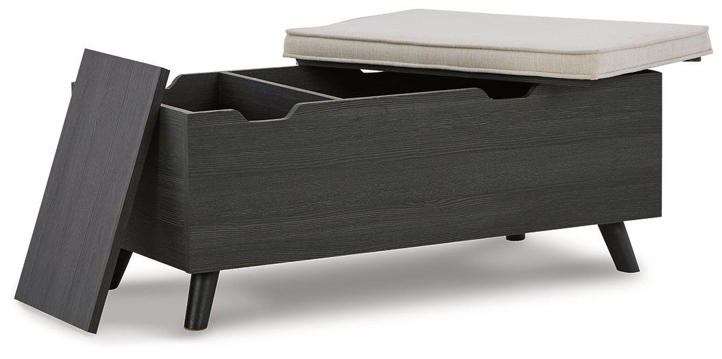 Ashley Furniture Yarlow Storage Bench with cushioned top and wooden legs, ideal for entryways or living rooms.