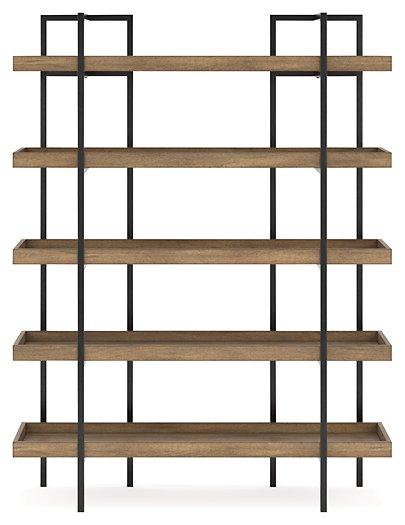 Ashley Montia 76-inch bookcase with multiple shelves and wood finish for stylish storage and display in living rooms or offices.