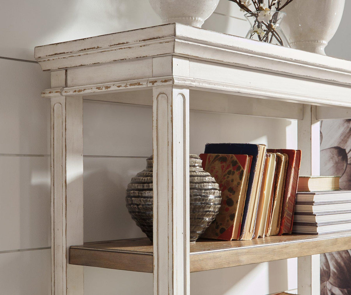 Ashley Furniture Realyn 75-inch bookcase with multiple shelves and a wooden finish, ideal for home or office storage.