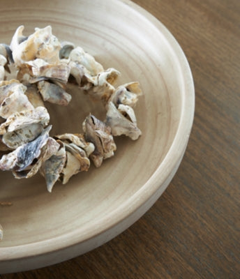 Ashley Furniture Justy Bowl showing a sleek, modern design with a smooth finish, ideal for decorative or functional use.