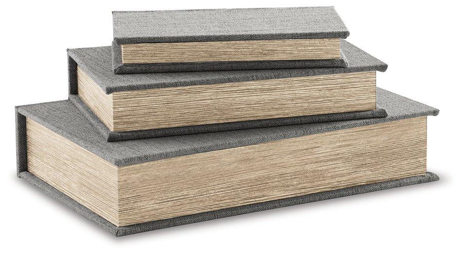 Set of three Ashley Furniture Jolina storage boxes with lid, made of sturdy material, ideal for organizing and decorating spaces.