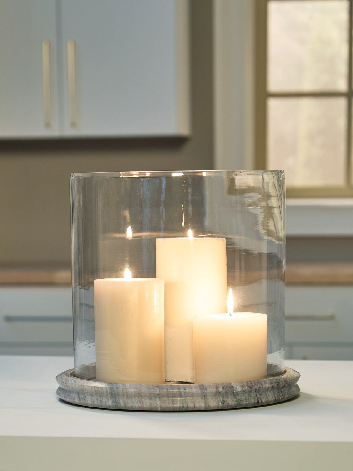 Ashley Furniture Saskia Candle Holder, decorative metal candle holder with intricate design, suitable for tabletop display.