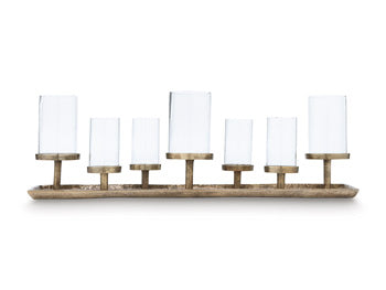 Ashley Furniture Wallmond Candle Holder displayed on a table, showcasing its modern design and sleek finish.