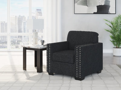 Ashley Furniture Jasmine Peaks Chair featuring a plush upholstered seat and wooden legs in a modern design.