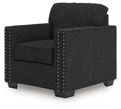 Ashley Furniture Jasmine Peaks Chair with plush fabric upholstery and wooden legs, shown at an angle from the side.