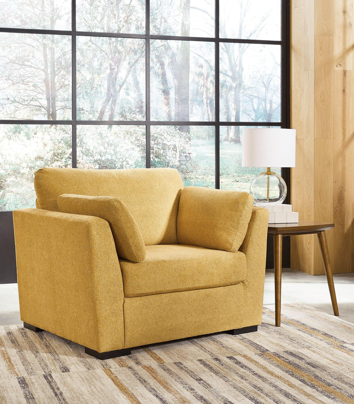 Oversized Ashley Furniture Keerwick chair with plush upholstery and wide seating for a modern, comfortable living space.