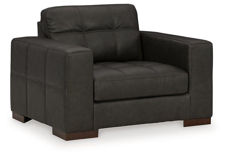 Ashley Furniture Luigi oversized chair with plush upholstery, modern design, and comfortable wide seating in a stylish living room setting.