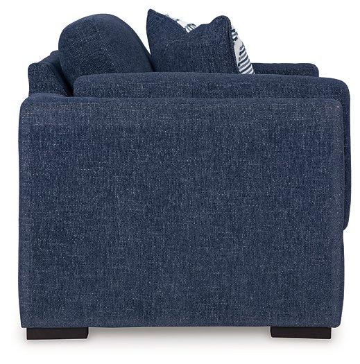 Oversized Ashley Furniture Evansley Chair with plush fabric and wide armrests, perfect for a cozy living room seating area.