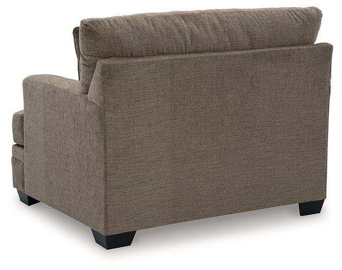 Oversized Ashley Furniture Stonemeade chair with plush cushioning and modern design, ideal for a cozy living room seating area.