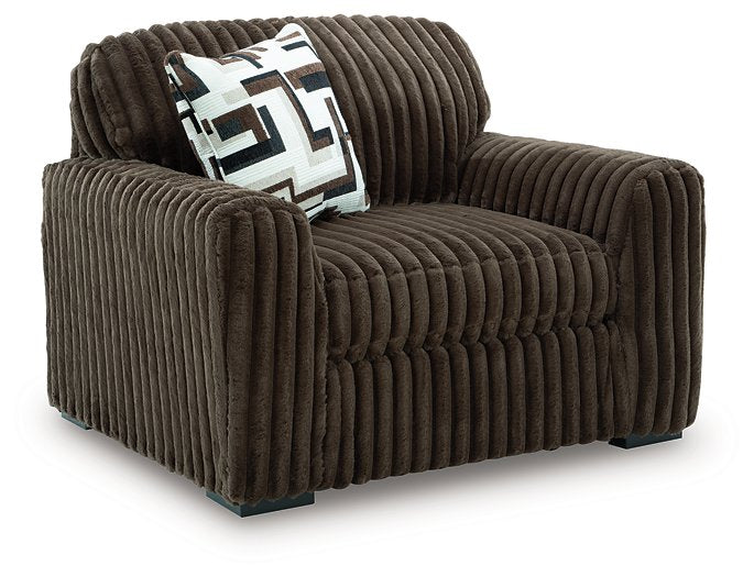 Oversized Midnight-Madness Ashley Furniture chair with plush fabric and wide seating, viewed from an angled perspective.