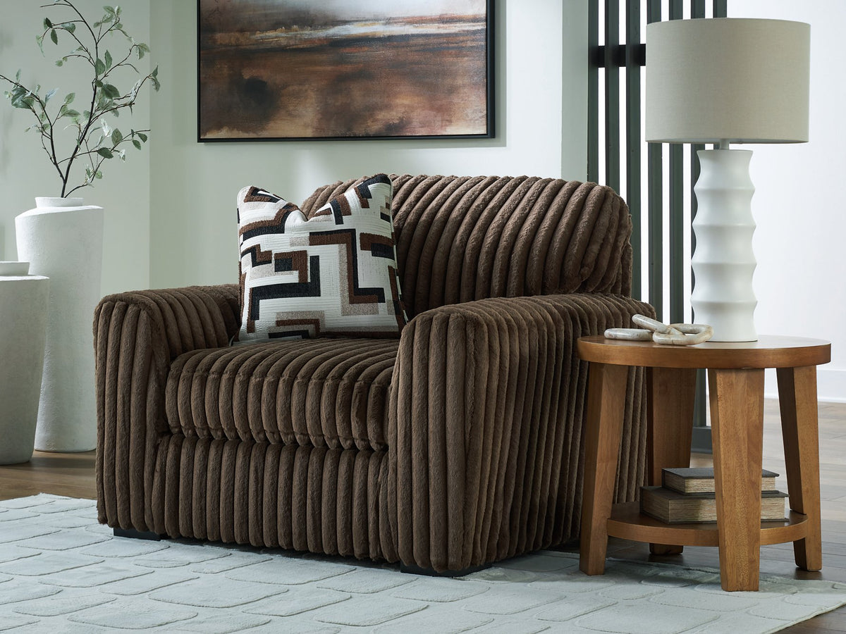 Oversized Midnight-Madness chair by Ashley Furniture featuring plush fabric and a modern design, shown in a stylish living room setting.