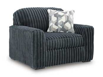 Ashley Furniture Midnight-Madness oversized chair with plush dark fabric and wide seating, shown from an angled view.