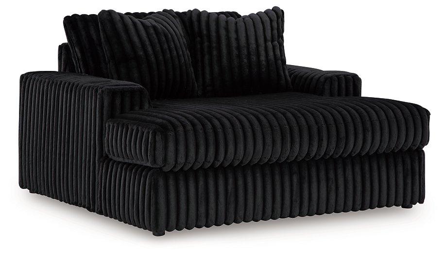 Oversized Midnight-Madness Ashley Furniture chair with plush upholstery and wide seating for a stylish, comfortable lounge.