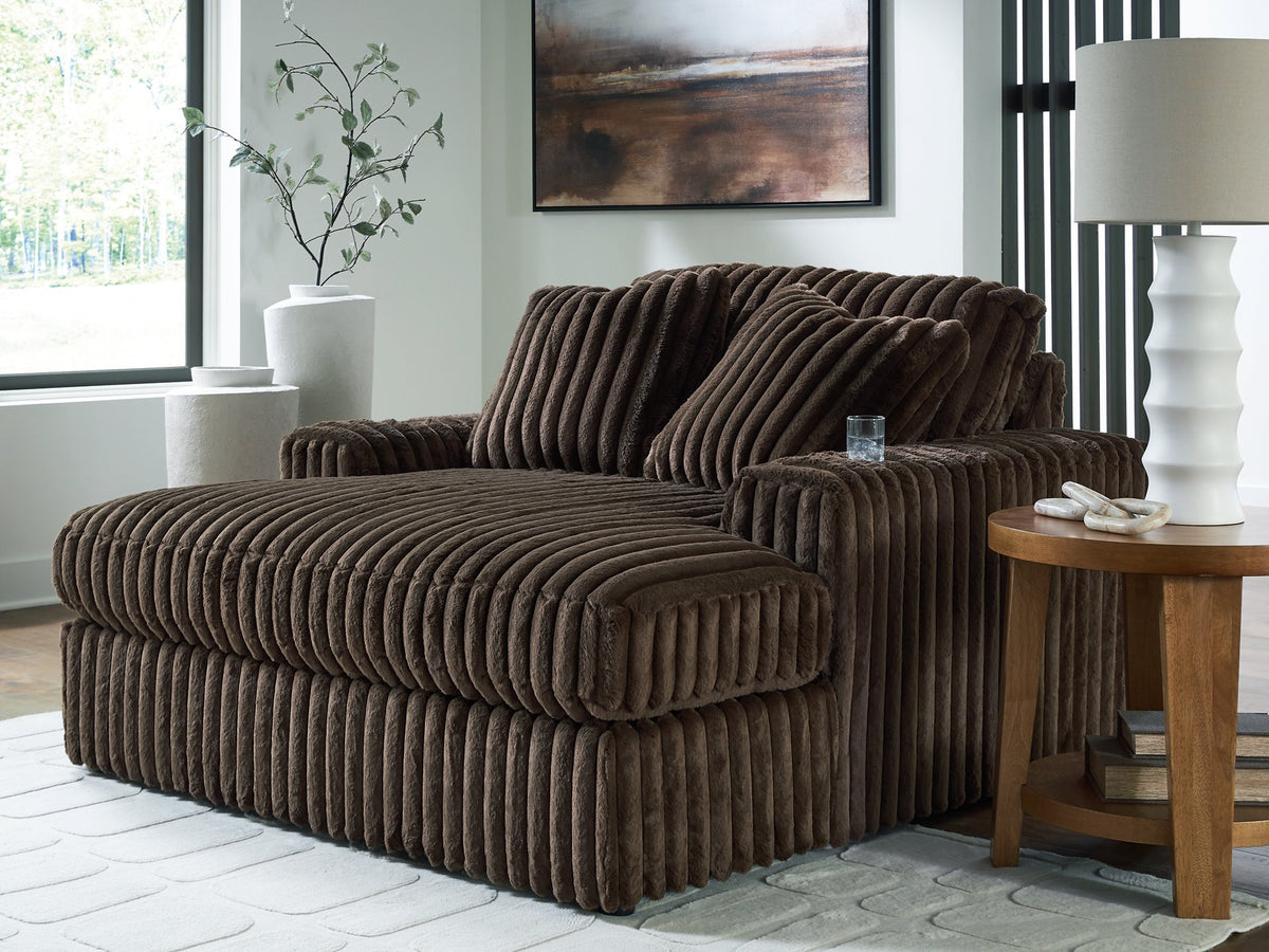 Ashley Furniture Midnight-Madness oversized chaise lounge chair with plush fabric and modern design, shown in a cozy living room setting.