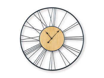 Ashley Furniture Brockett wall clock with a modern round design and black finish, hanging on a wall in a stylish room.
