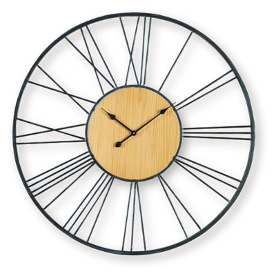 Ashley Furniture Brockett wall clock with a round design and modern style, hanging on a wall in a cozy living space.