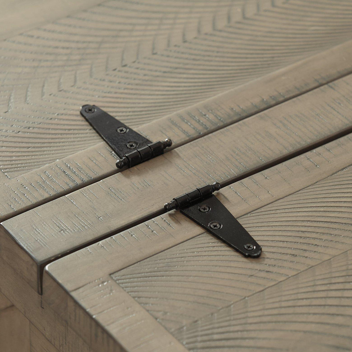 A modern Ashley Furniture Aldwin coffee table with built-in storage, featuring a sleek wooden finish and contemporary design.