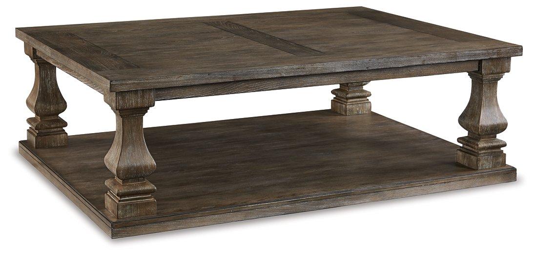 Ashley Furniture Johnelle coffee cocktail table with a sleek wooden surface and modern design, ideal for living room decor.