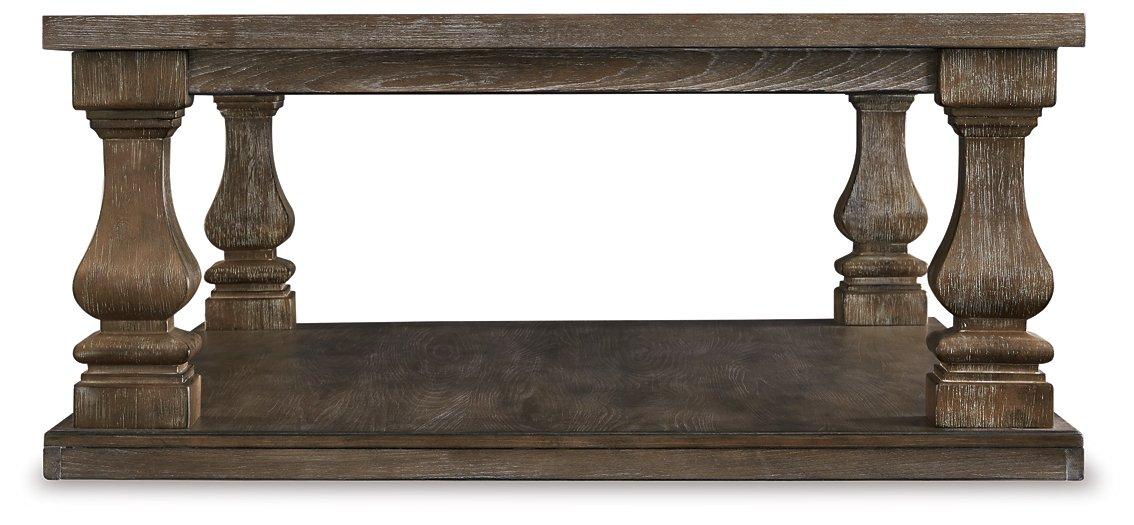 Ashley Johnelle coffee cocktail table with a sleek wooden top and modern design, perfect for living room decor.