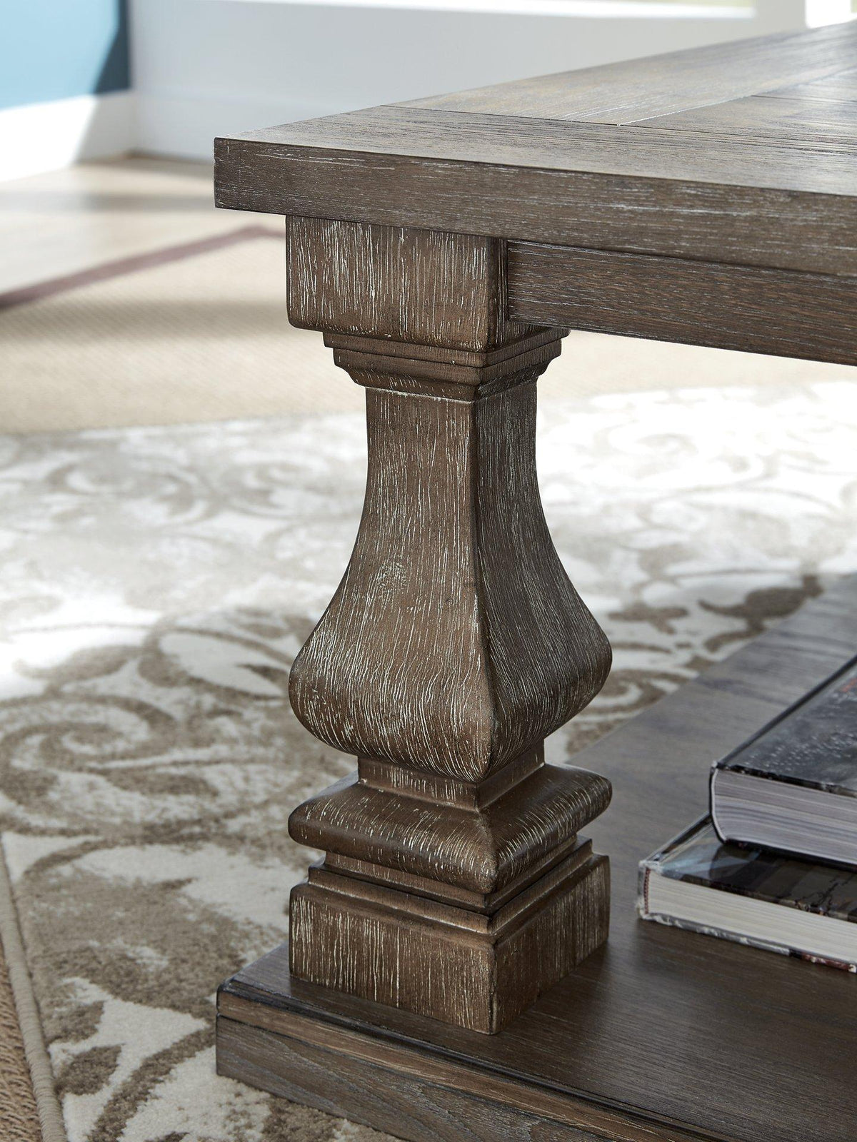 Ashley Johnelle coffee table, modern cocktail table with a sleek wooden finish, perfect for living room décor.
