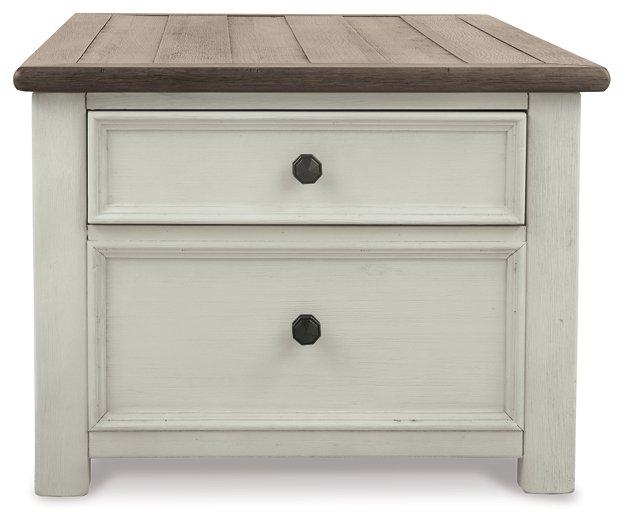 Ashley Furniture Bolanburg coffee table with lift top, showing the wooden surface and modern design in a living room setting.