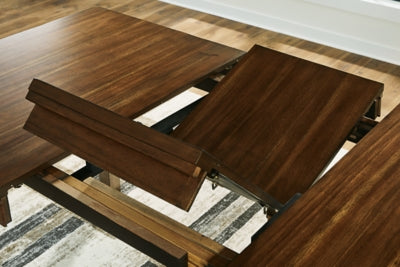Close-up of Ashley Furniture Ralene counter height dining extension table with leaf detail showing its wood finish and extension mechanism.