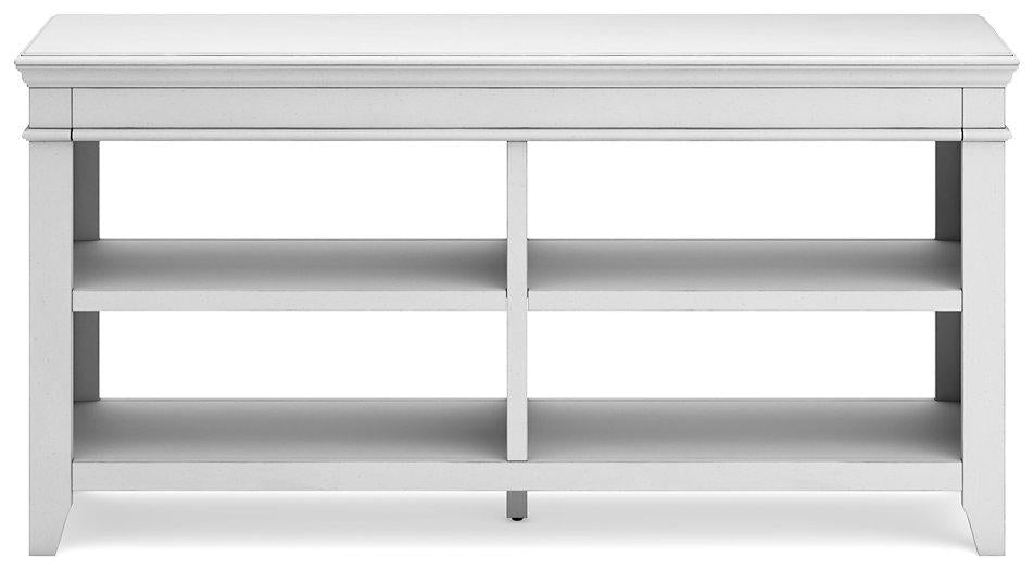 Ashley Furniture Kanwyn Credenza curio with glass doors and wood finish, showcasing decorative items inside.