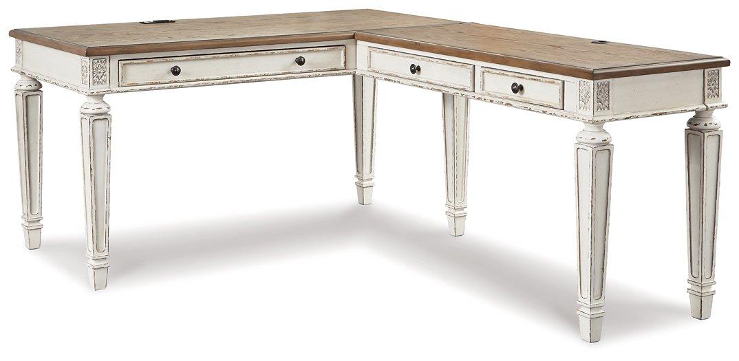 Realyn 2-piece home office desk set by Ashley Furniture, featuring a modern workspace with a sleek desk and matching components.
