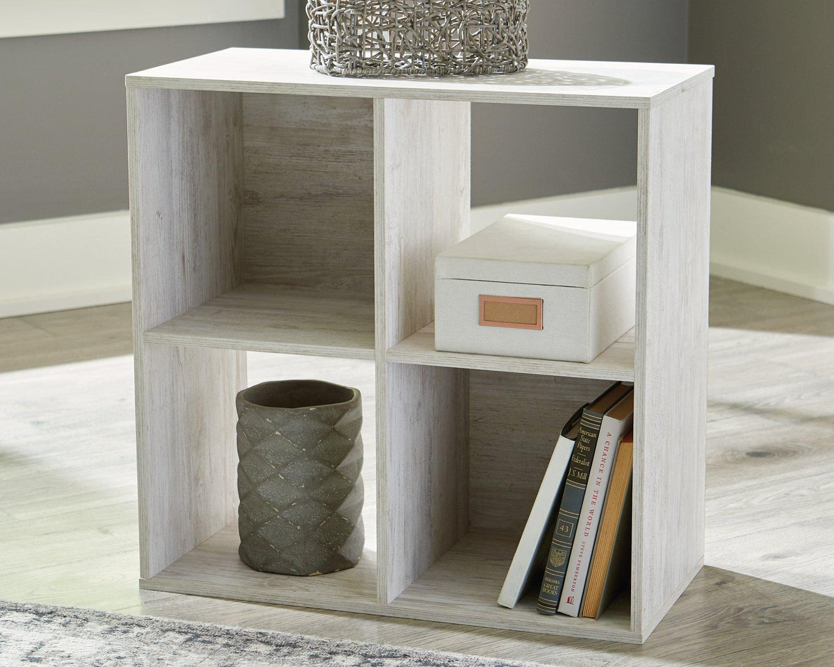 Ashley Furniture Paxberry Four Cube Organizer with wood finish and open cube compartments for versatile storage.