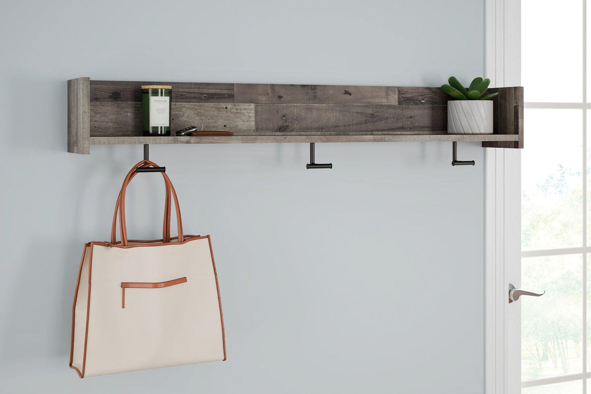 Wall-mounted Ashley Furniture Neilsville coat rack with shelf, featuring hooks and a sturdy wooden surface for organized entryway storage.