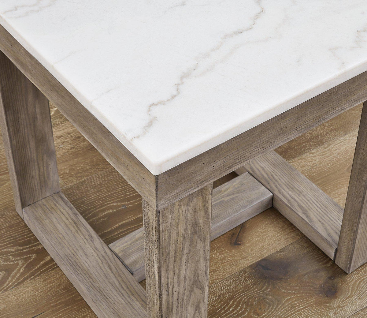 Ashley Furniture Loyaska End Table with a sleek wooden finish and modern design, perfect for living room or bedroom decor.