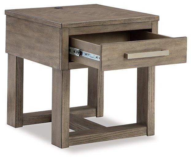 Ashley Furniture Loyaska End Table with wooden top and sleek metal legs, ideal for living room or bedroom decor.