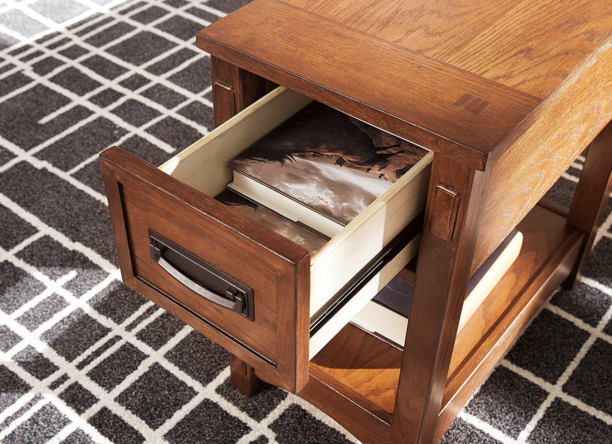 Ashley Furniture Breegin chairside end table with a wooden finish, compact design, and smooth surface for convenient living room use.