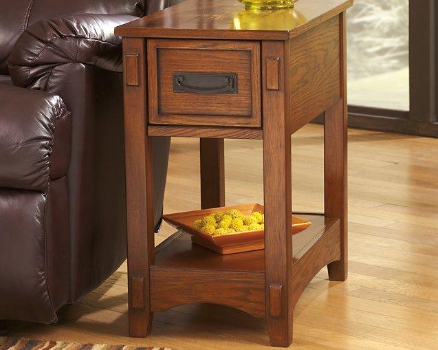 Ashley Furniture Breegin chairside end table with wood finish, compact design, and storage shelf for living room use.
