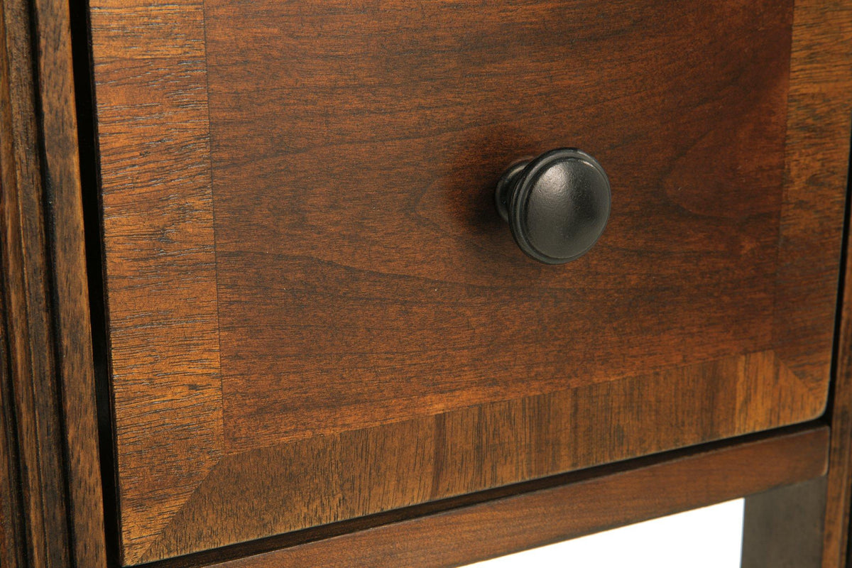 Ashley Furniture Breegin chairside end table with a sleek wooden surface and sturdy legs, designed for convenient side placement.