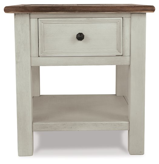 Ashley Furniture Bolanburg end table with a wood finish, featuring a sleek top and sturdy legs, designed for living room decor.