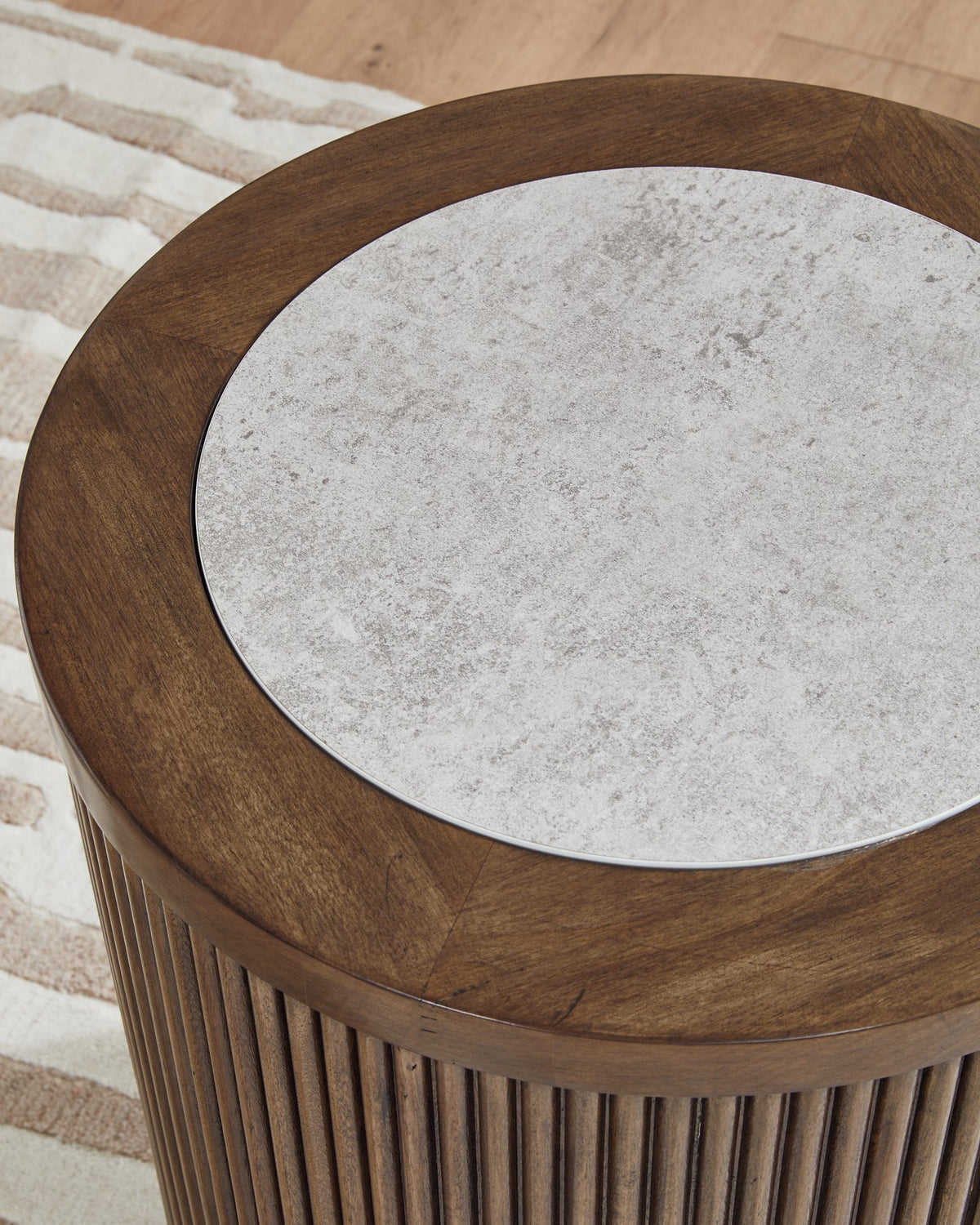 Ashley Furniture Hadonna End Table with wood finish and sleek design, featuring a spacious top and stylish legs.