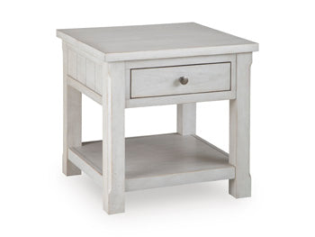 Ashley Furniture Robbinsdale end table with a closed drawer and angled design, featuring a dark wood finish.
