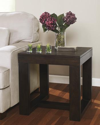 Ashley Furniture Watson End Table with a sleek wooden surface and modern design, ideal for living room or bedroom decor.