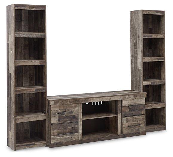 Derekson 3-piece entertainment center by Ashley Furniture with TV stand and storage cabinets in a modern living room setting.