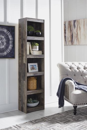 Derekson 3-piece entertainment center by Ashley Furniture with open shelves and space for a TV in a modern living room setting.