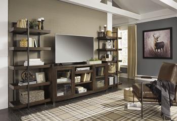 Starmore 3-piece Ashley Furniture entertainment center with TV stand, shelves, and storage cabinets in a modern design.