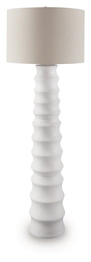 Ashley Furniture Veraleigh floor lamp with a tall, modern design featuring a sleek metal stand and a fabric lampshade.