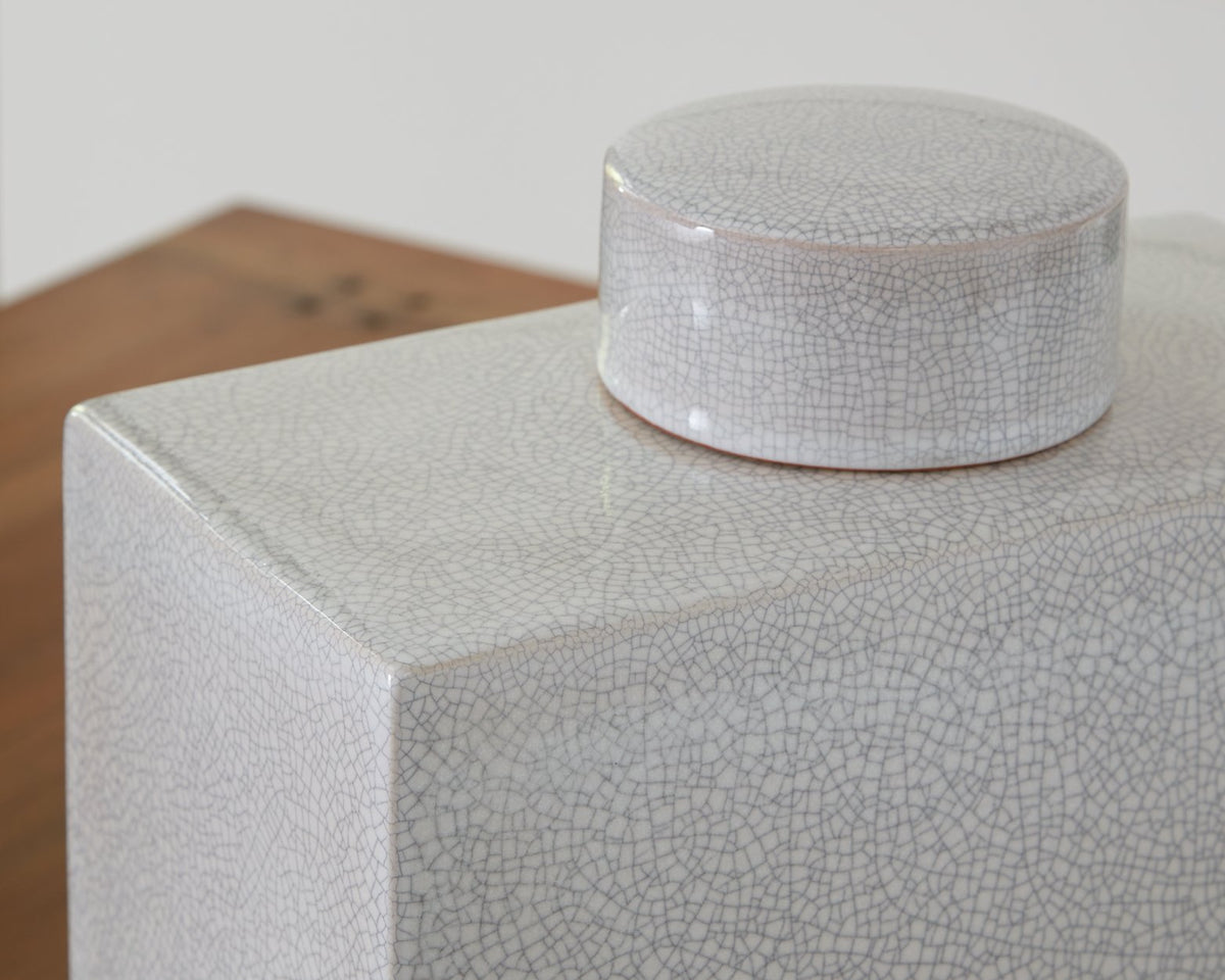 Ashley Furniture Haddworth jar with decorative ceramic design and antique finish, shown in a close-up detail shot.
