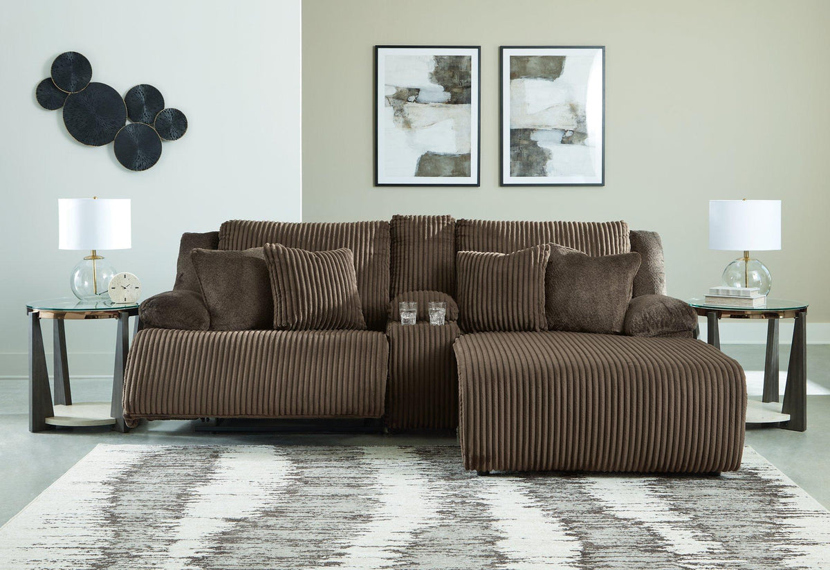 Ashley Furniture Top Tier living room set featuring a sofa, loveseat, and armchair with plush cushions and stylish upholstery.